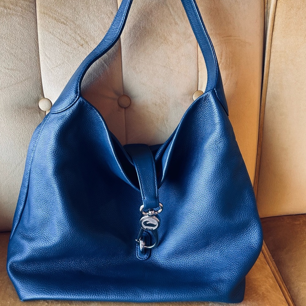 Dooney and Bourke pebble large lock shoulder bag. Navy blue